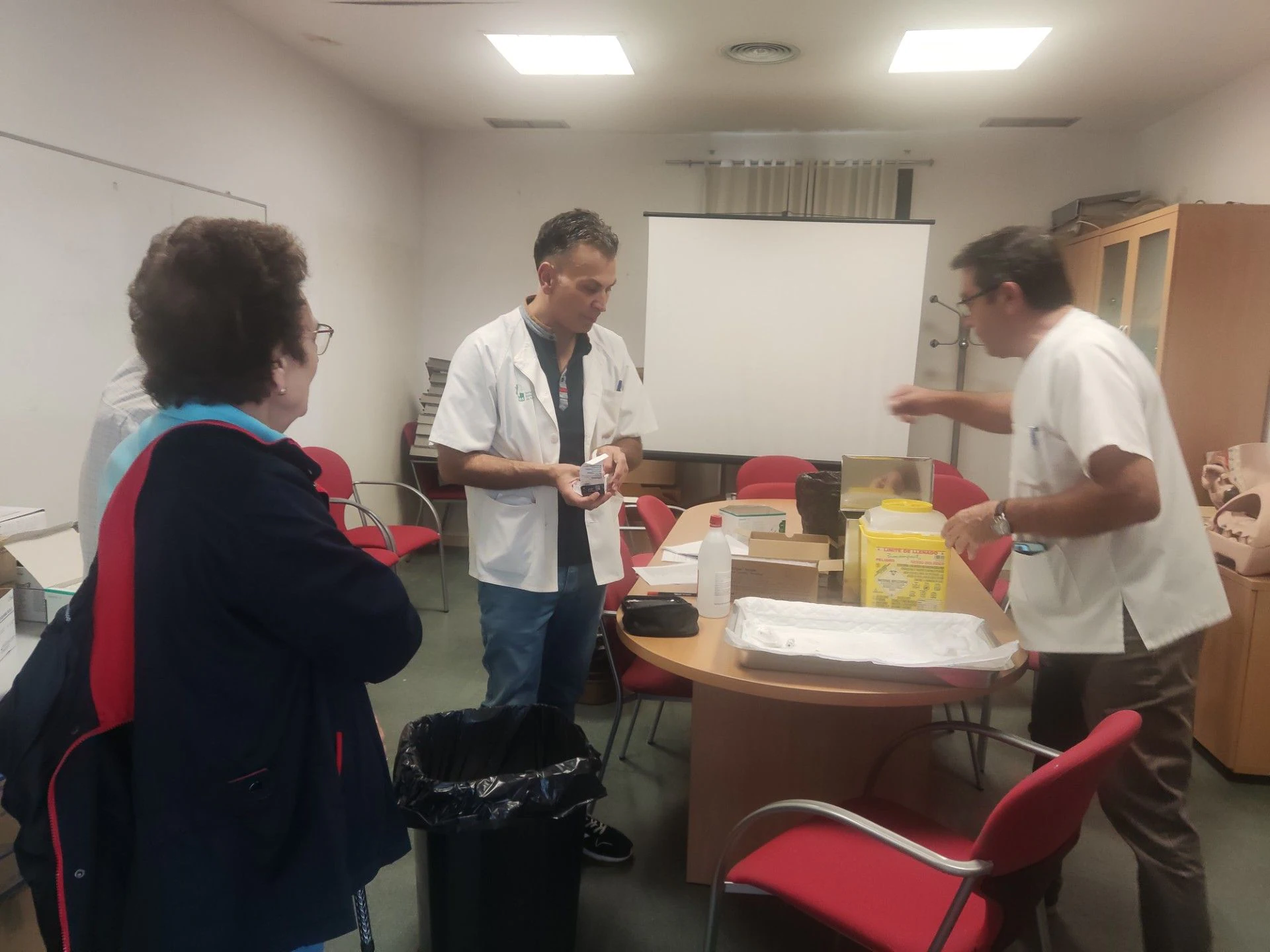 Nurses attending to older patients getting vaccinated.